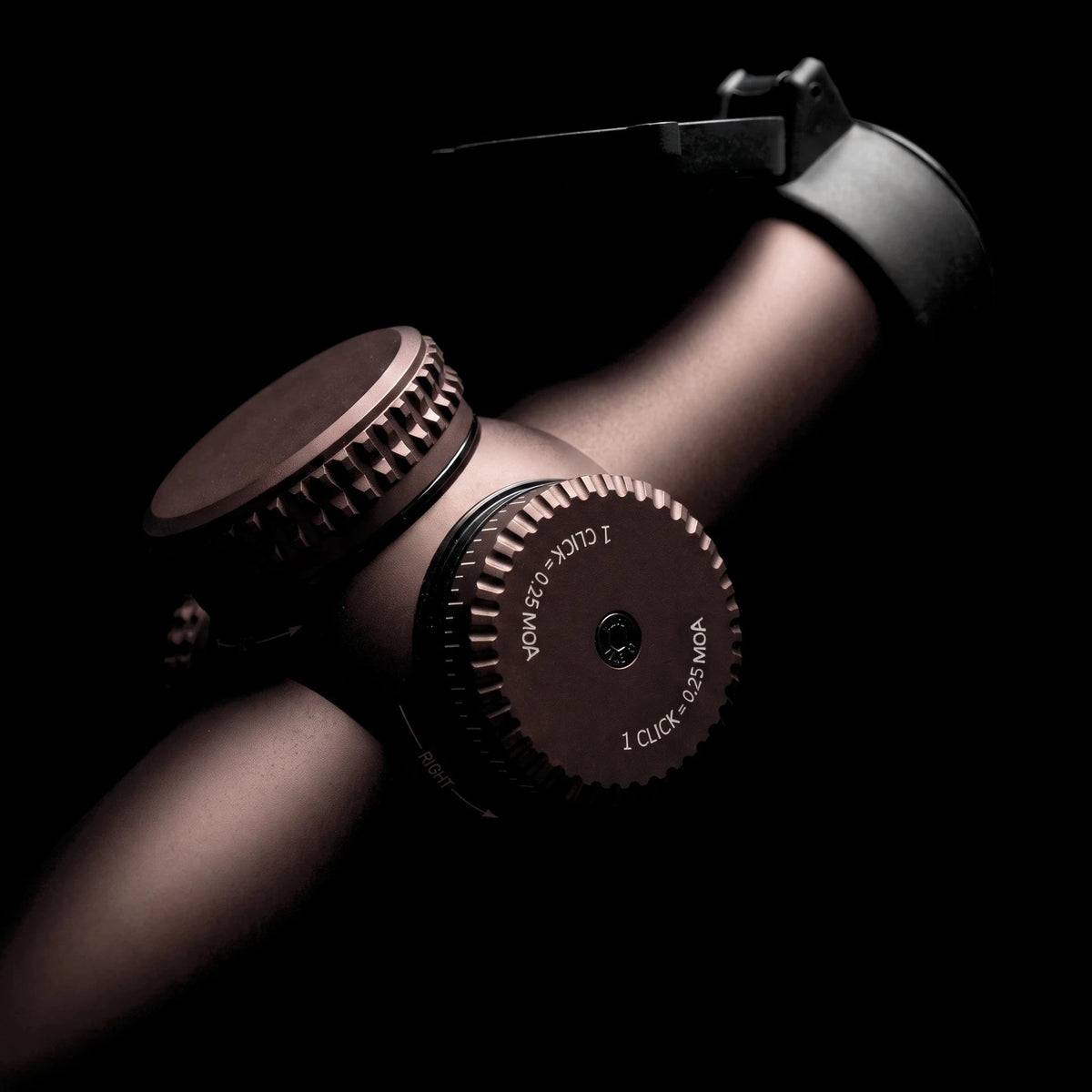 Night Operators RZ 1-10 up close: the capped windage turret marked 1 click equals 0.25 MOA, the capped elevation turret and the flip up lens cover